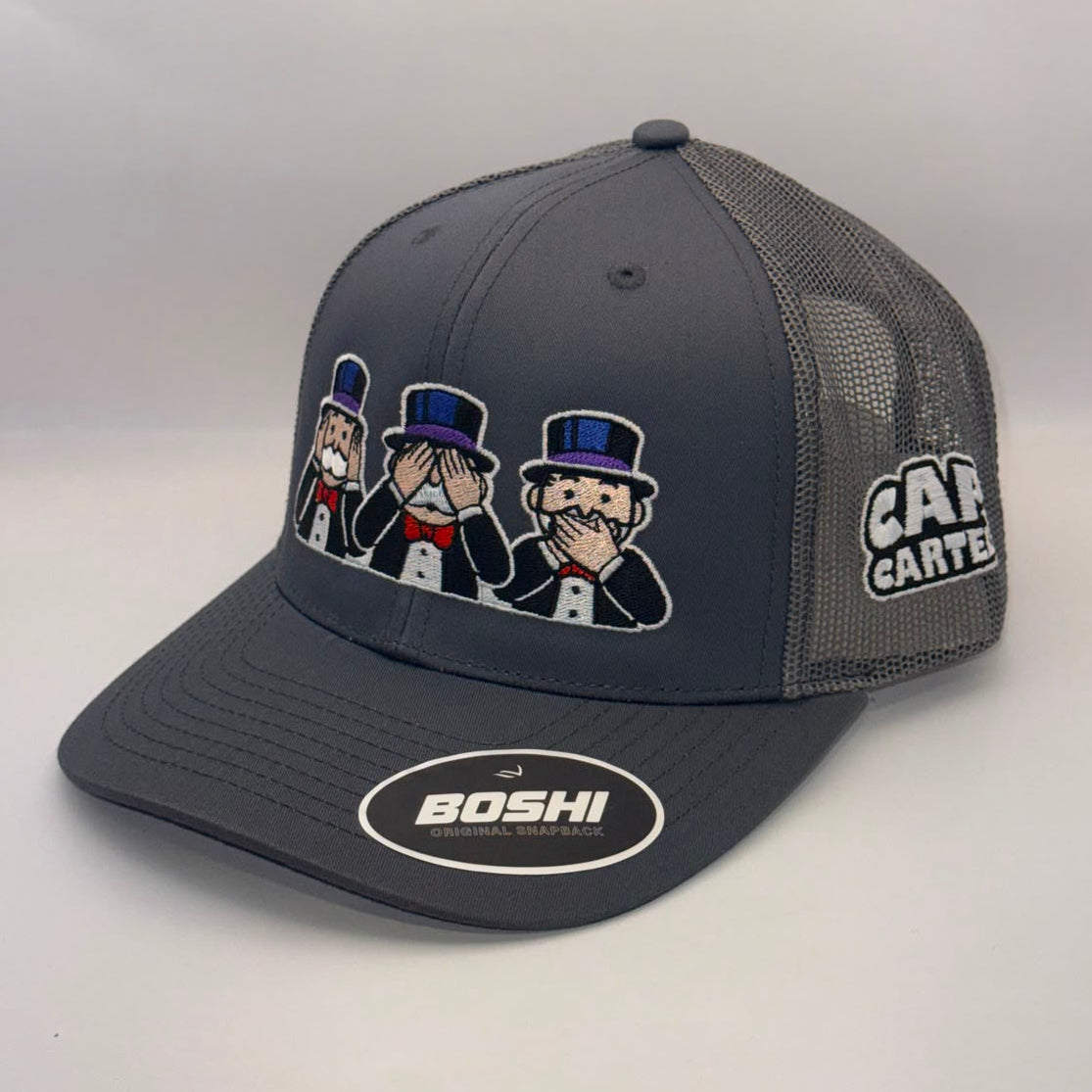 A dark gray and black mesh-back trucker hat featuring a cartoon graphic of three men in top hats on the front, a 'CART CARTEL' logo on the side, and a 'BOSHI' sticker on the visor.